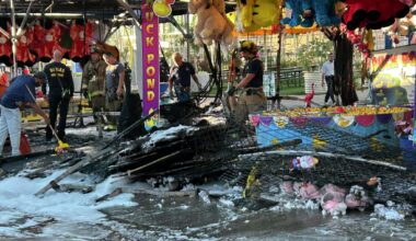 Dallas firefiighters work the scene at a midway game at the Texas State Fair Monday morning following a fire.