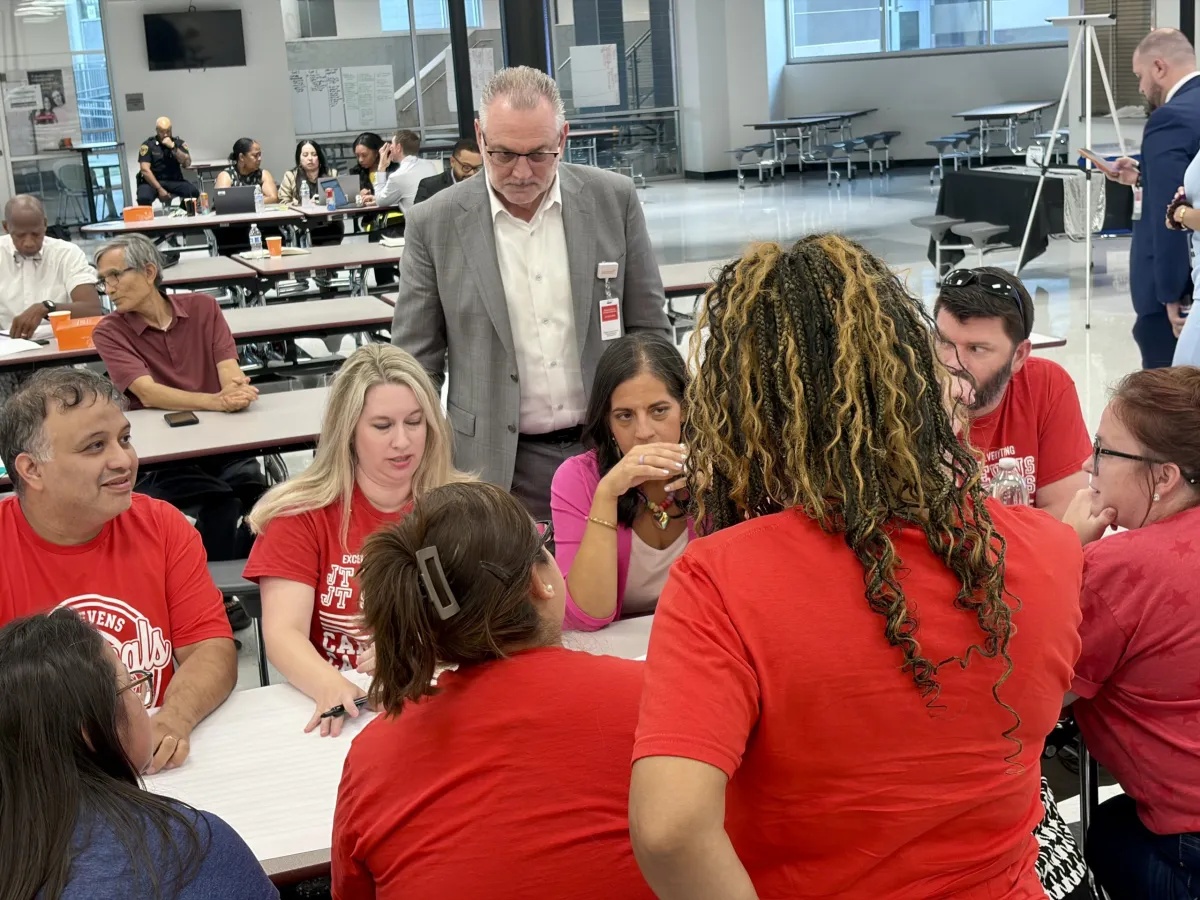 Fort Worth ISD Superintendent Peter Licata, center, listens to a group of J.T. Stevens Elementary parents during a session Aug. 24 at South Hills High School. 