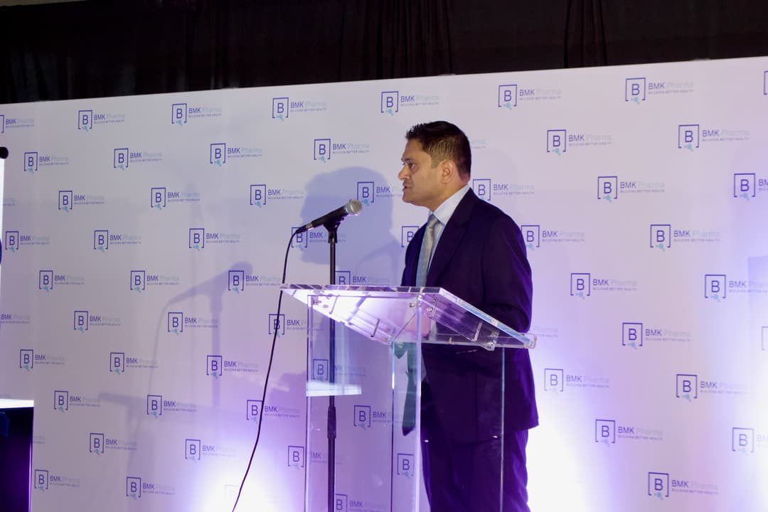 a man speaking at a podium 