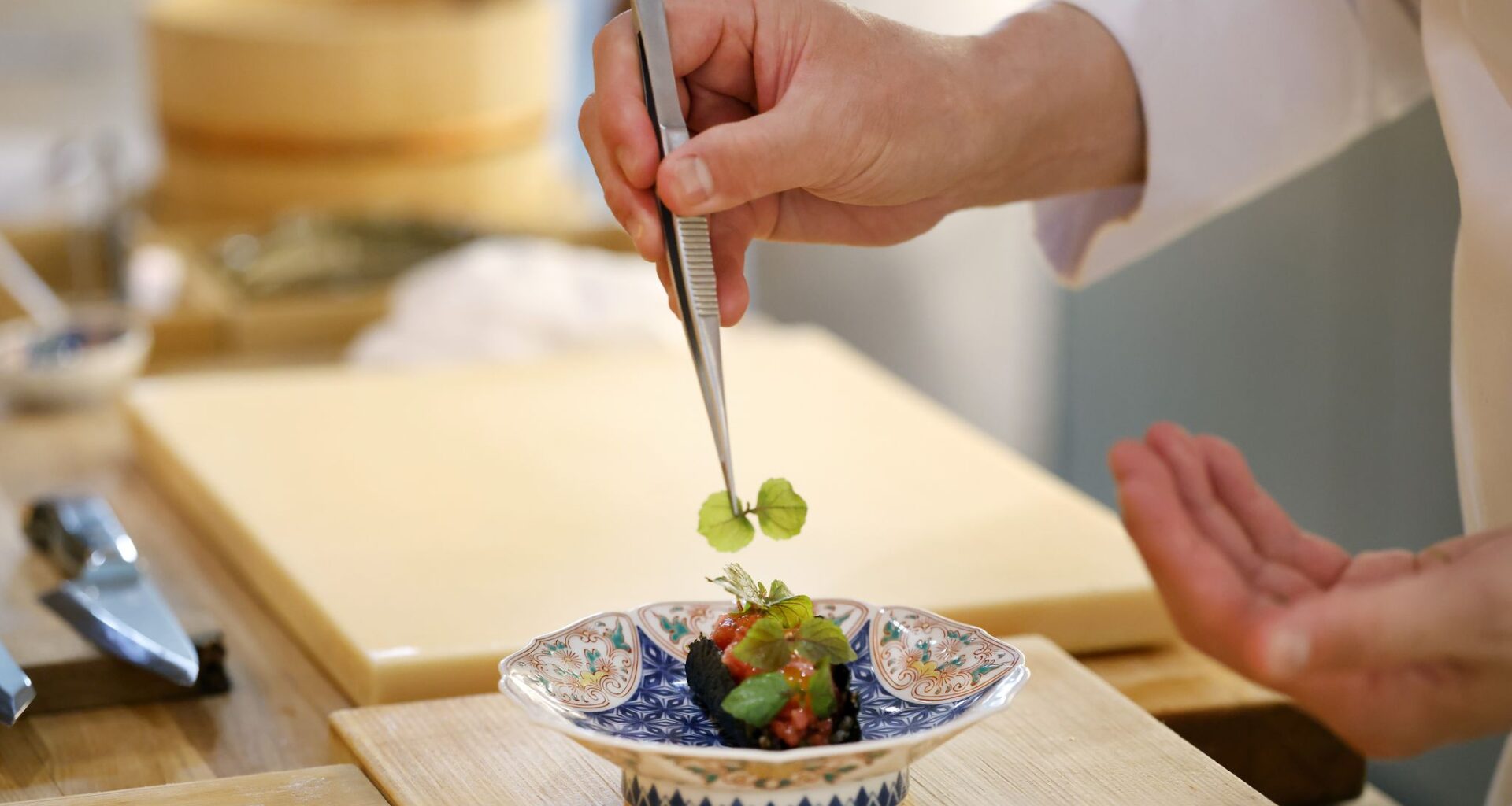 Chef Tatsuya Sekiguchi prepares sushi at Tatsu Dallas, one of two Michelin-starred restaurants in Dallas right now.