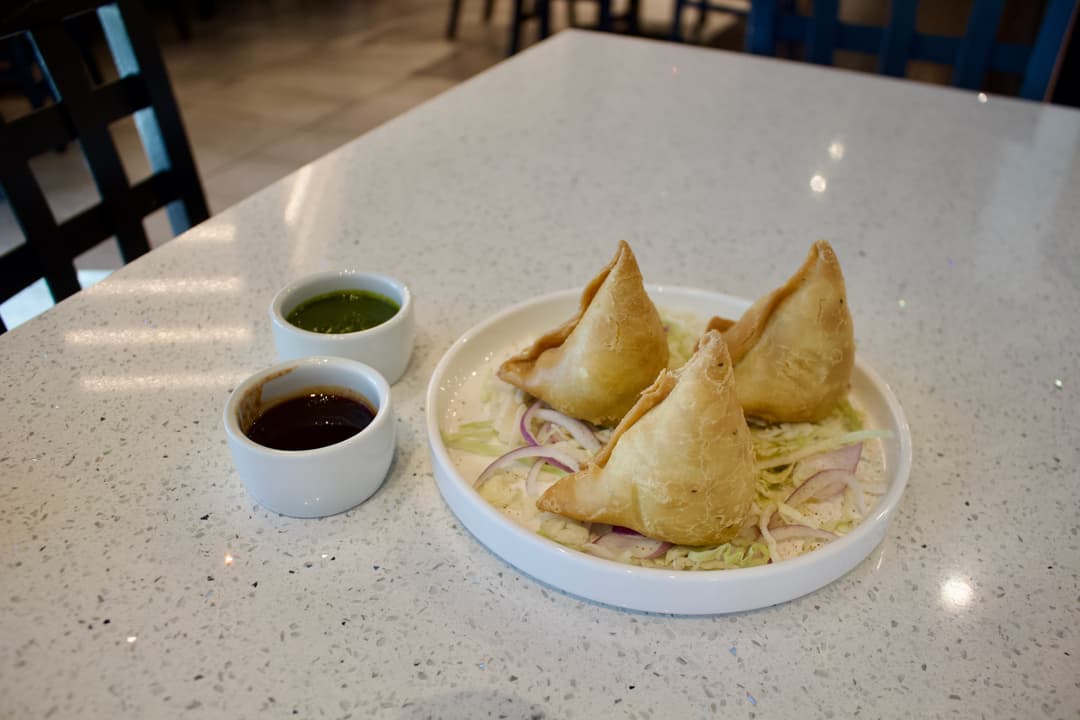 a plate of samosas
