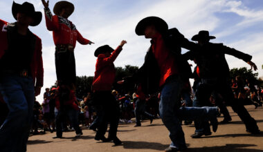 Dancers with the Top Royal Cadets perform in the parade in front of Big Tex during opening day of the State Fair of Texas at Fair Park in Dallas, Friday, Sept. 25, 2026.