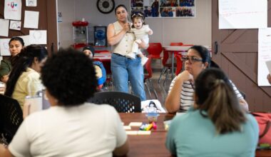 Maria Elena Gonzalez Rodriguez holds daughter Emma Aurora Pina Gonzalez and listens to a lecture at Bachman Lake Together Family Center in Dallas on Tuesday, Oct. 6, 2026.