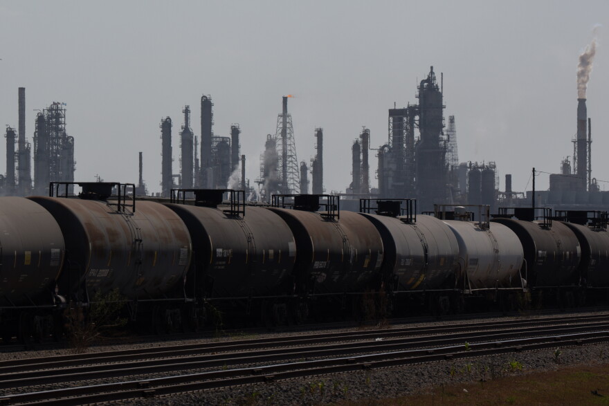 Train cars sit on the tracks next to a Valero facility in Corpus Christi.