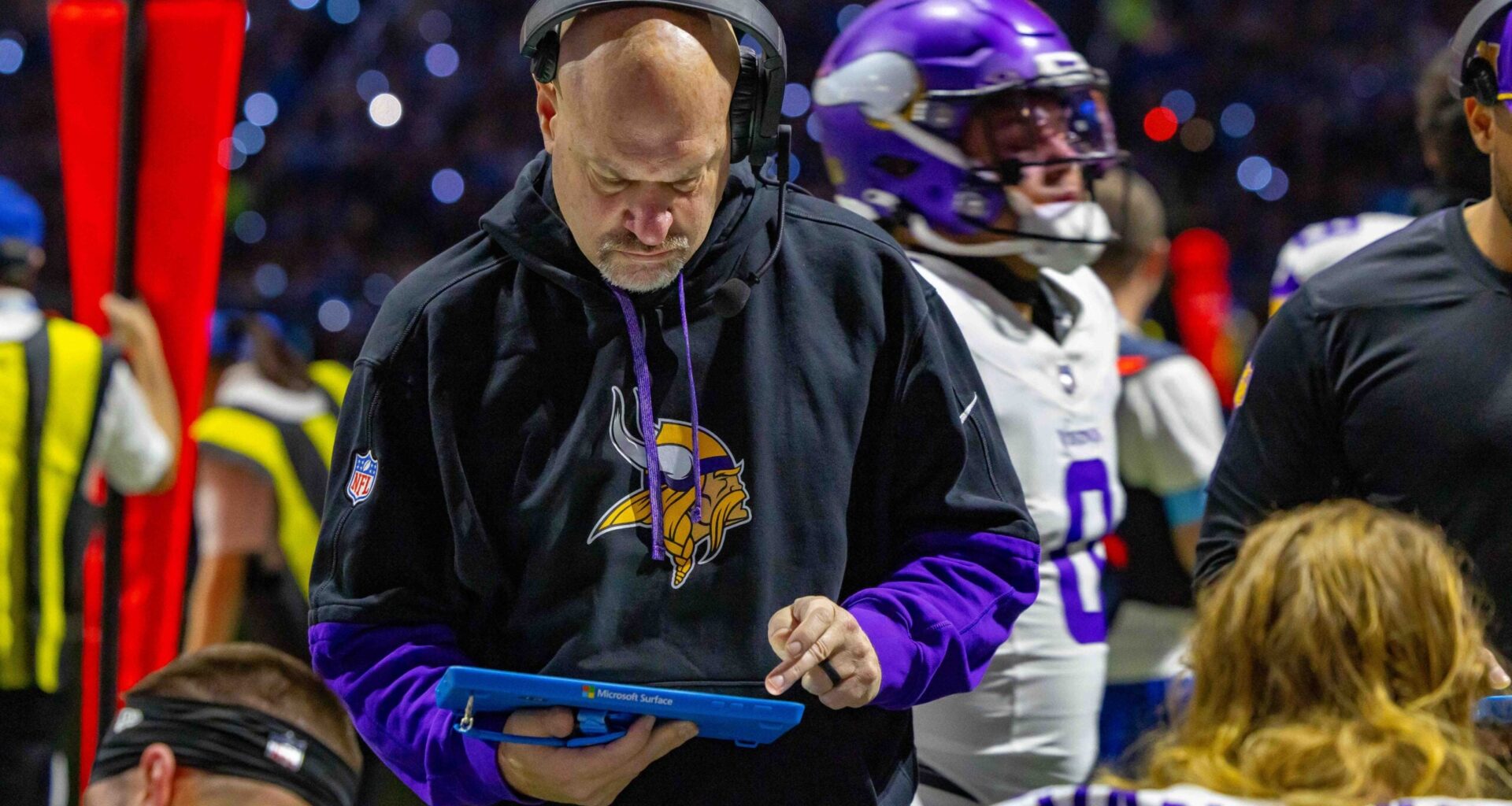 Jan 5, 2025; Detroit, Michigan, USA; Minnesota Vikings Assistant Head Coach / Outside Linebackers Mike Pettine talks to players on the bench during the first half of the game against the Detroit Lions at Ford Field.