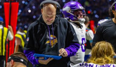 Jan 5, 2025; Detroit, Michigan, USA; Minnesota Vikings Assistant Head Coach / Outside Linebackers Mike Pettine talks to players on the bench during the first half of the game against the Detroit Lions at Ford Field.