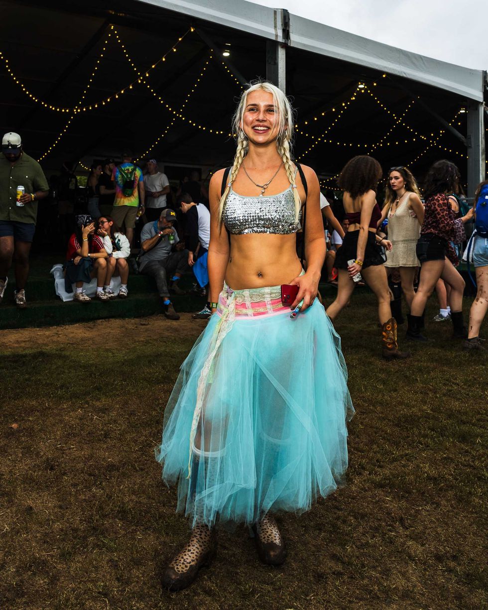 Audrey Dahlkemper wears a teal tulle skirt and sequin bra