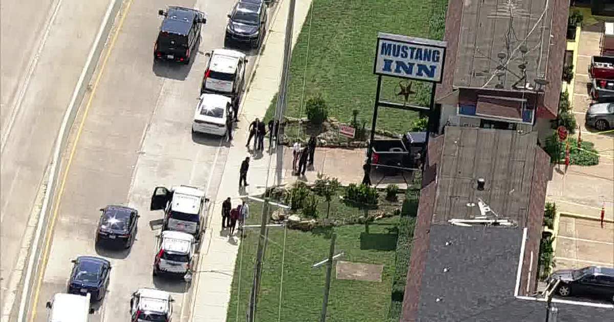 Armed suspect dies from self-inflicted gunshot during Dallas police warrant operation at motel