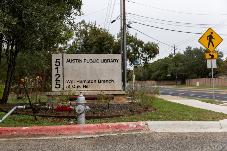An exterior sign of a library building.