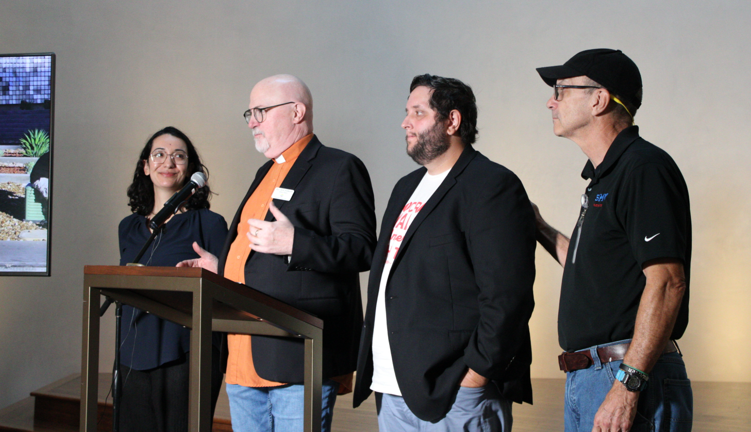 Kessler Park UMC Rev. Eric Folkerth joins organizers Lanie Olmo and John Putnam inside Cathedral of Hope in Oak Lawn.