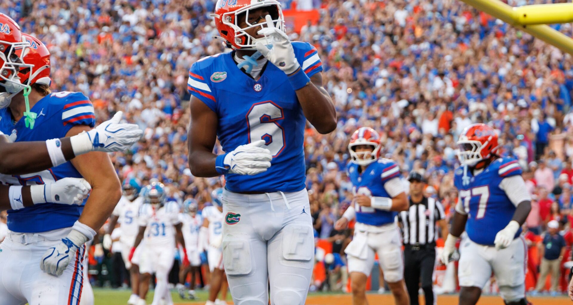 Sep 26, 2026; Gainesville, Florida, USA; Florida Gators wide receiver Dallas Wilson (6) gestures after scoring a touchdown against the Mississippi Rebels during the second half at Ben Hill Griffin Stadium.