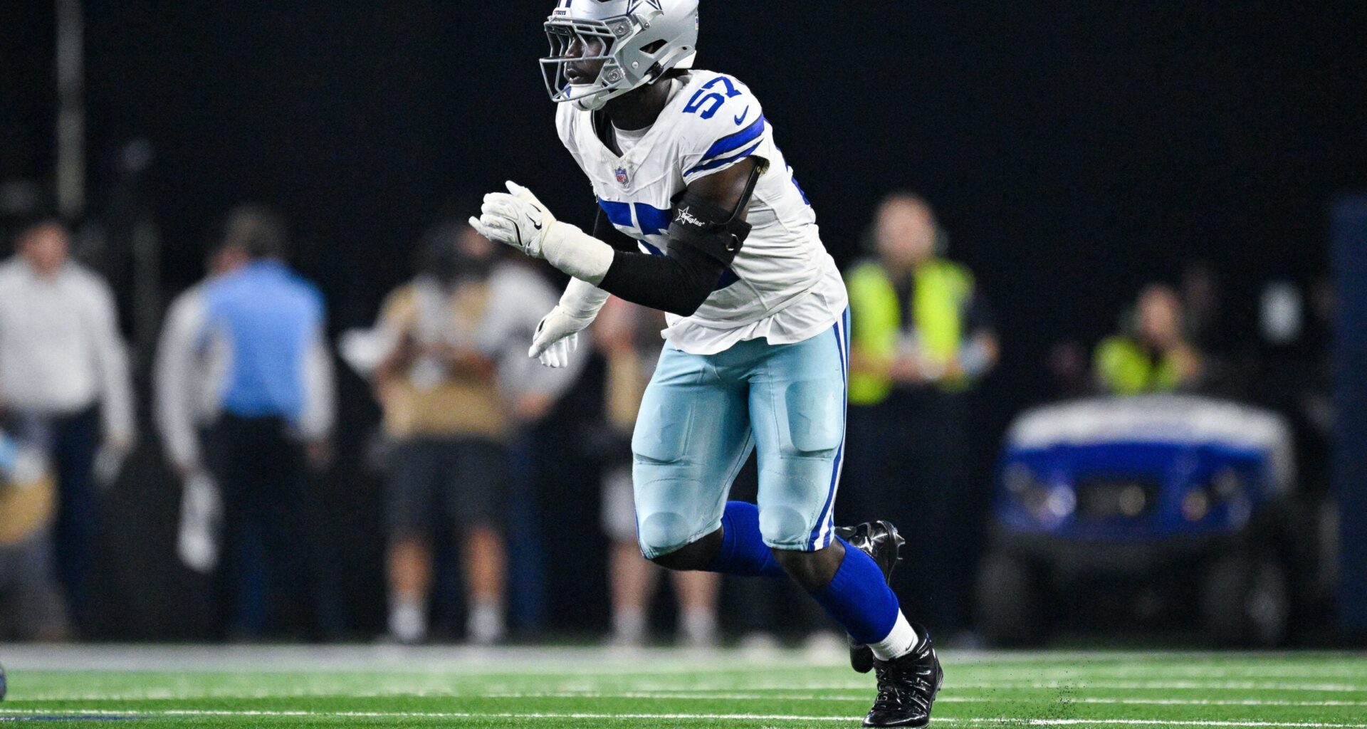 Oct 8, 2026; Arlington, Texas, USA; Dallas Cowboys linebacker Malachi Lawrence (57) rushes the line during the game between the Cowboys and the Buccaneers at AT&T Stadium.