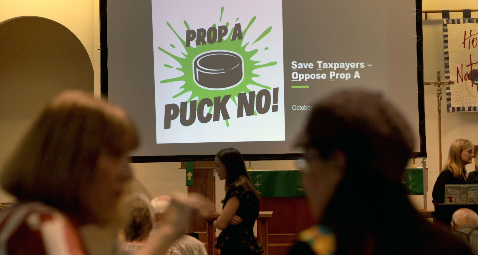 Event organizers converse before the start of a community event organized by the Stop the Stars political action committee in Plano on October 6, 2026.