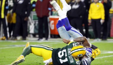 Dallas Cowboys defensive tackle Lt Overton (99) leans over in a chair as he and his defensive teammates watch the Green Bay Packers run out the clock during the fourth quarter at Lambeau Field in Green Bay, Wisconsin, October 18, 2026.