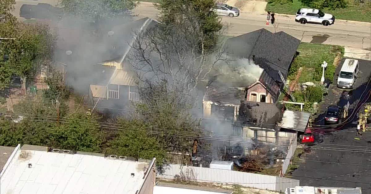 Fort Worth fire damages home and sheds