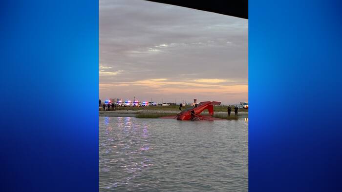 Plane seen upside down near runway of Scholes International Airport in Galveston
