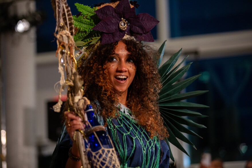 Bining Taylor models Debra Martinez’s design, “The Swamp Witch: Keeper of Forgotten Things,” at the Austin Creative Reuse “Reuse on the Runway 2026” show in Austin, Texas, on Oct. 17, 2026. Joe Ferrara / KUT News