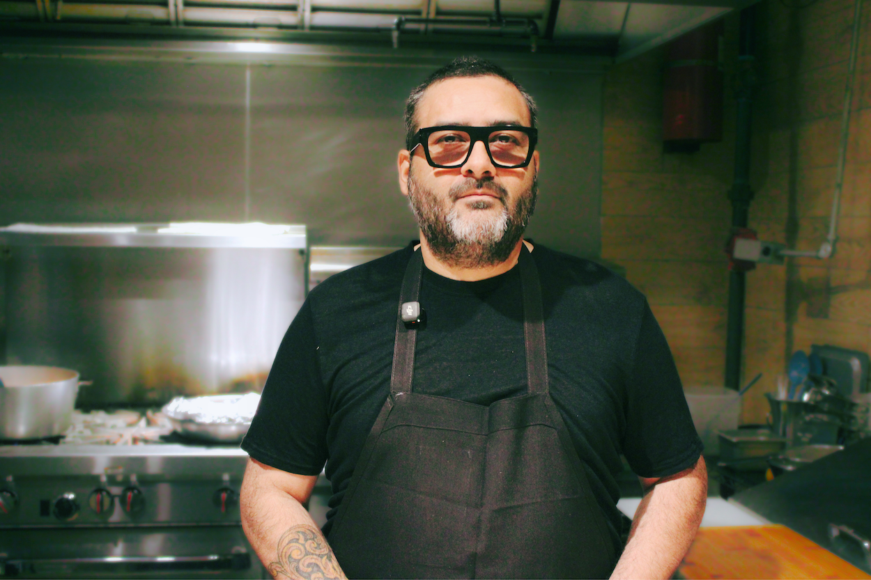 chef regino Rojas standing in his kitchen