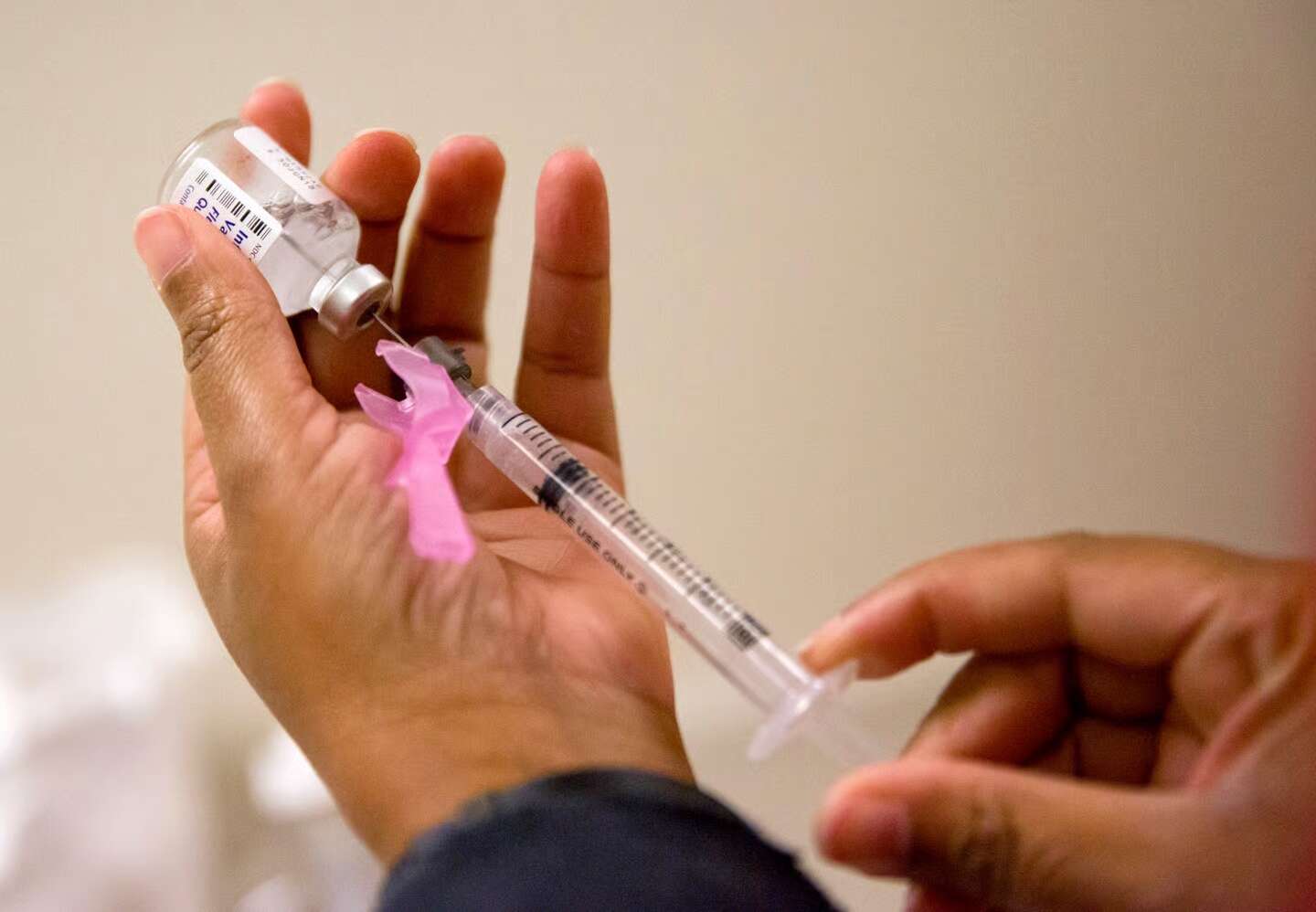 A nurse prepares a flu shot at the Salvation Army in Atlanta. (David Goldman/Associated Press file)
