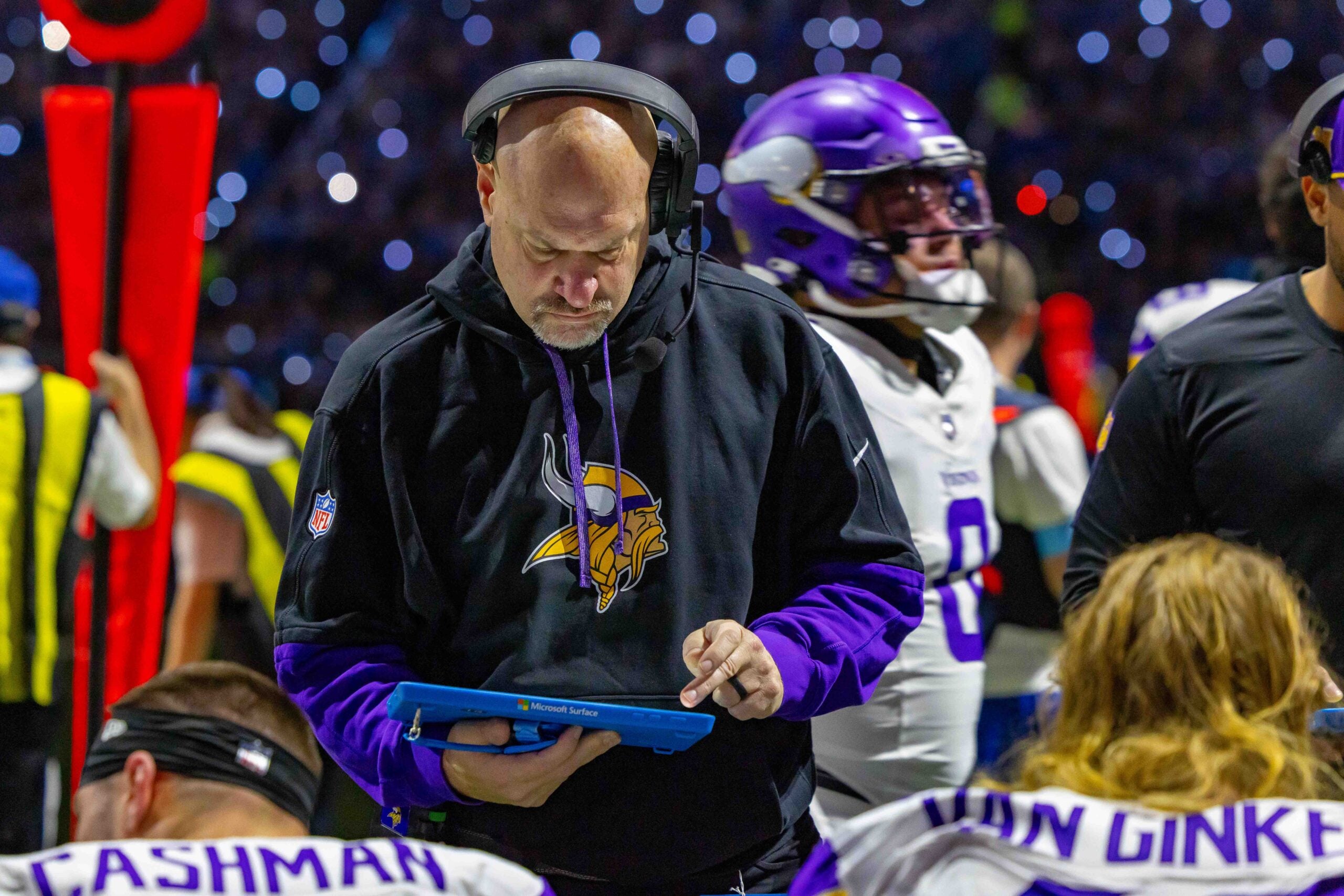 Jan 5, 2025; Detroit, Michigan, USA; Minnesota Vikings Assistant Head Coach / Outside Linebackers Mike Pettine talks to players on the bench during the first half of the game against the Detroit Lions at Ford Field.