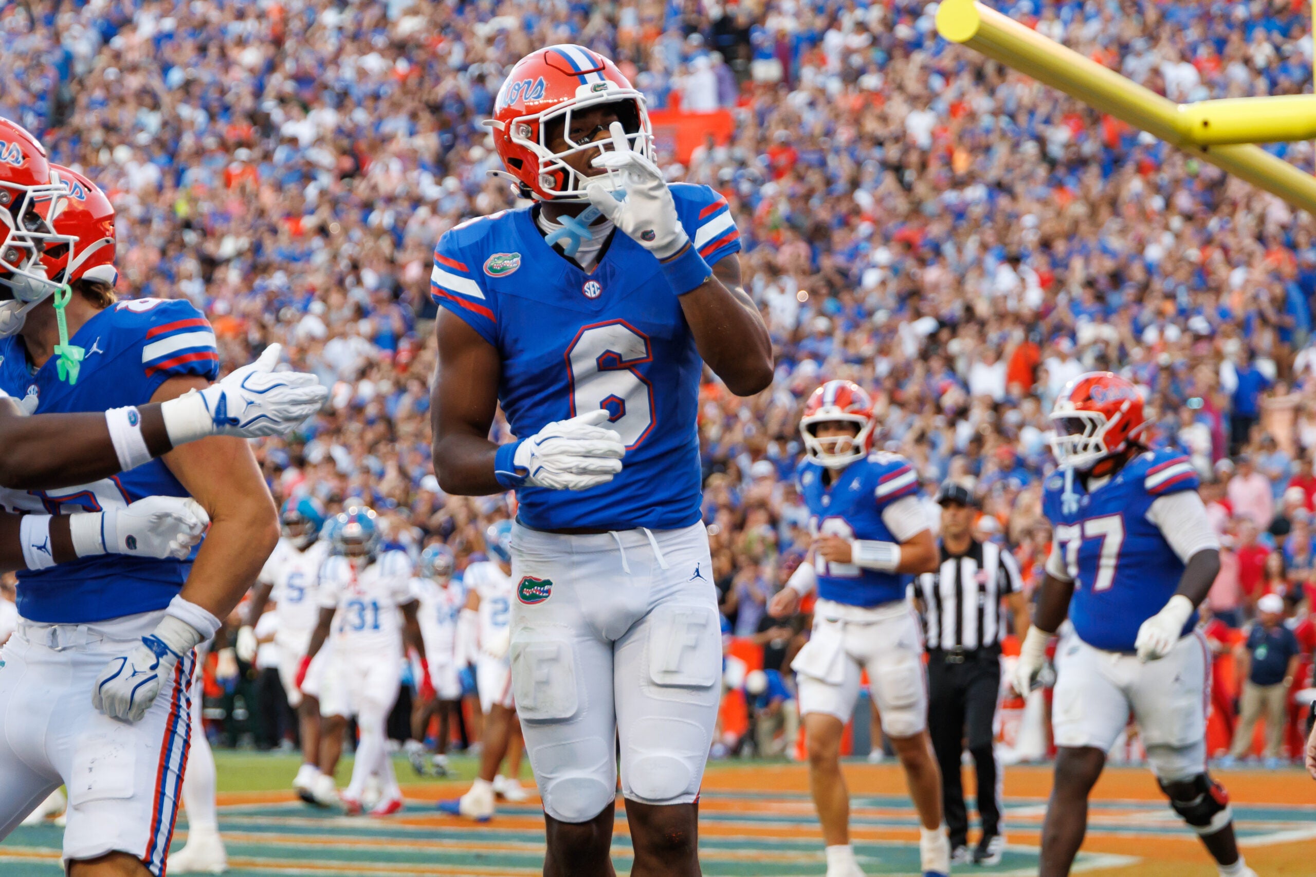 Sep 26, 2026; Gainesville, Florida, USA; Florida Gators wide receiver Dallas Wilson (6) gestures after scoring a touchdown against the Mississippi Rebels during the second half at Ben Hill Griffin Stadium.