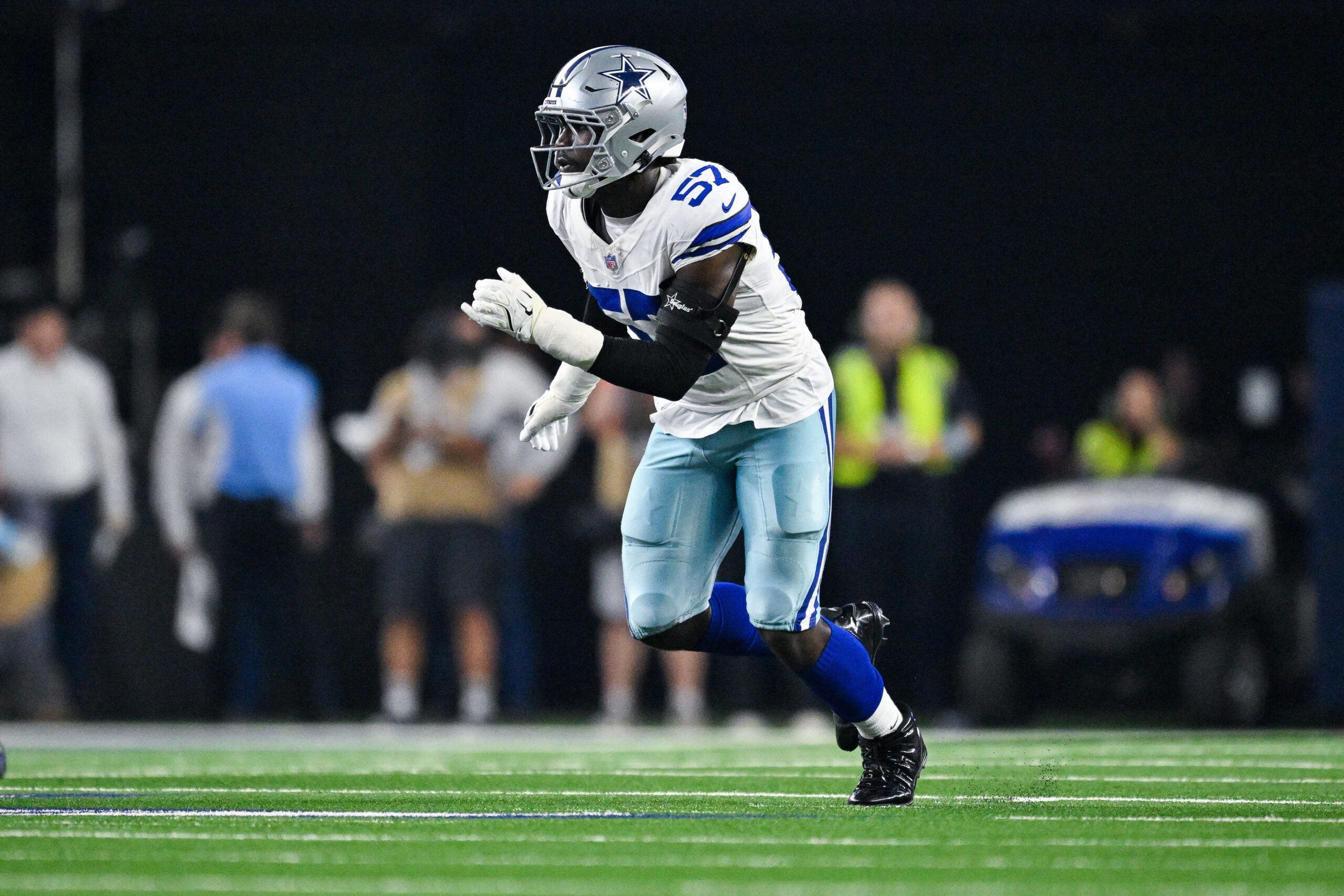 Oct 8, 2026; Arlington, Texas, USA; Dallas Cowboys linebacker Malachi Lawrence (57) rushes the line during the game between the Cowboys and the Buccaneers at AT&T Stadium.