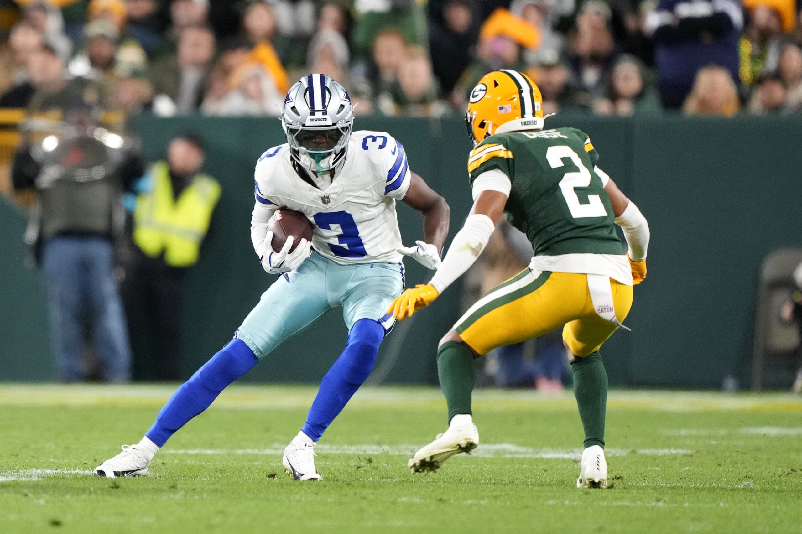 Oct 18, 2026; Green Bay, Wisconsin, USA; Dallas Cowboys wide receiver George Pickens (3) runs the ball against Green Bay Packers cornerback Brandon Cisse (2) during the second half at Lambeau Field.