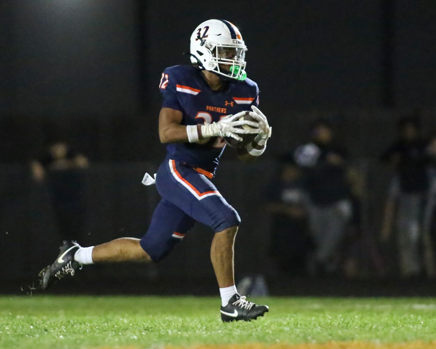 Oswego's Quinten Jackson Jr (32) runs back an interception to ice the game between Oswego East at Oswego Friday, Oct 17, 2025 in Oswego.