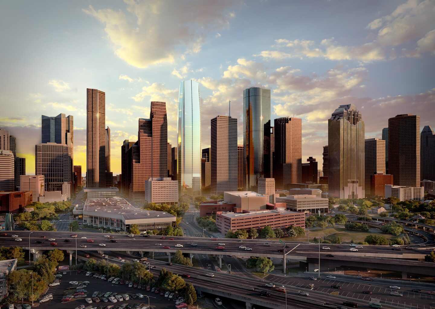 A city skyline at sunset featuring tall skyscrapers, highways with traffic, and scattered clouds in the sky.