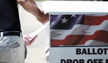 A voter drops off their ballot at a drop box. (The Gazette file)