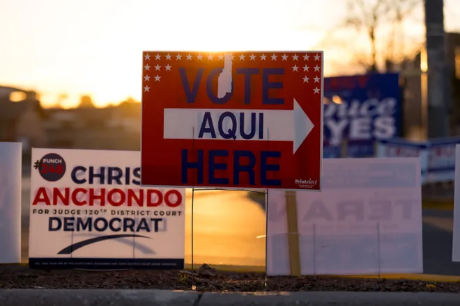 Campaign signs surround “Vote Here” signs pointing to the Marty Robbins Recreation Center polling site during the 2026 Texas Primary Election on Tuesday, March 3, 2026, in El Paso.