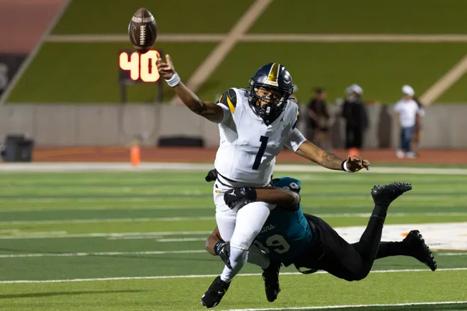 Eastwood’s Kingston Jeffries throws a pass as Pebble Hills’ Jayden Frasier tackles him during a District 1-6A football game Thursday, Oct. 1, 2026, at SAC 1 in El Paso, Texas.