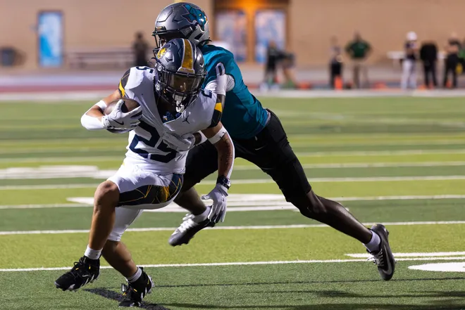 Eastwood’s Matthew Ramirez runs the ball as Pebble Hills’ LJ Bailey attempts a tackle during a District 1-6A football game Thursday, Oct. 1, 2026, at SAC 1 in El Paso, Texas.