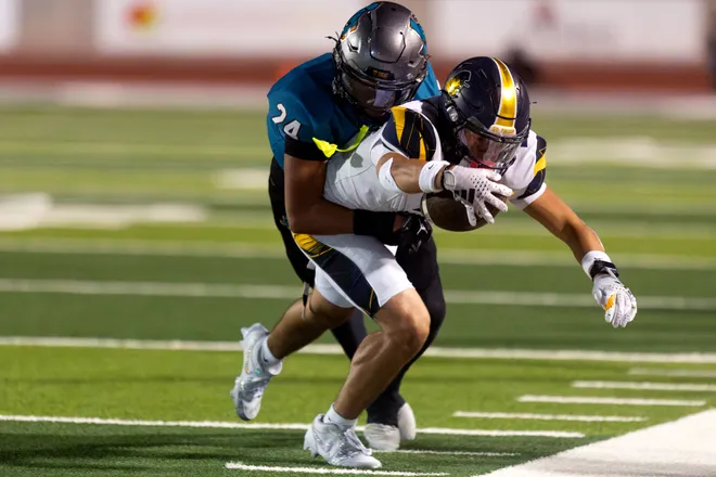 Eastwood’s Bentley De Vries carries the ball as Pebble Hills’ Elijah Barragan tackles him during a District 1-6A football game Thursday, Oct. 1, 2026, at SAC 1 in El Paso, Texas.