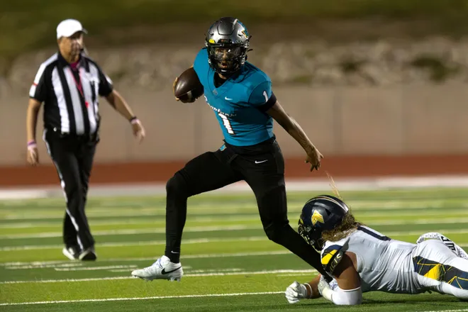 Pebble Hills’ Joe Fernandez runs the ball as Eastwood’s Zacary Adams attempts a tackle during a District 1-6A football game Thursday, Oct. 1, 2026, at SAC 1 in El Paso, Texas.