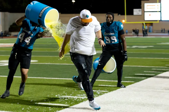 Pebble Hills players pour Powerade over head coach Ryan Warner after a District 1-6A football game against Eastwood Thursday, Oct. 1, 2026, at SAC 1 in El Paso, Texas