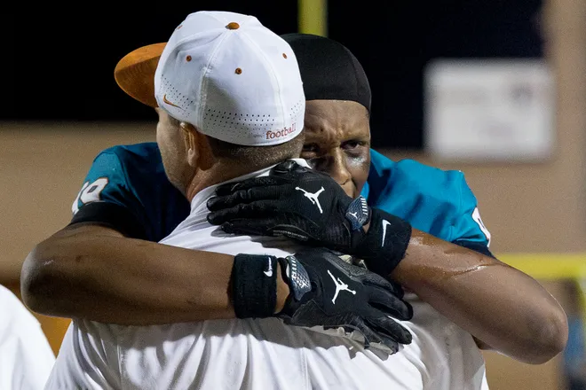 Pebble Hills’ Jayden Frasier hugs head coach Ryan Warner after a District 1-6A football game against Eastwood Thursday, Oct. 1, 2026, at SAC 1 in El Paso, Texas.