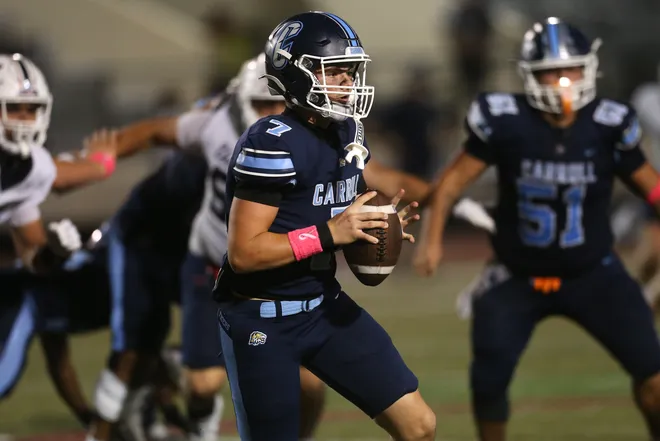 Carroll quarterback Seth Neatherlin throws on the run during a district football game against Veterans Memorial at Buccaneer Stadium on Friday, Oct. 9, 2026.