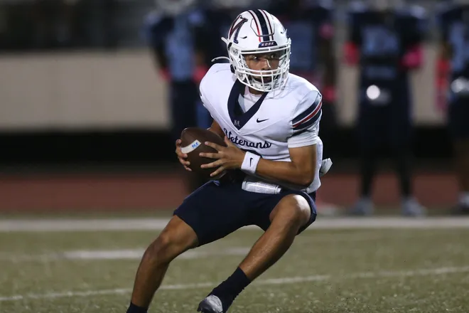 Veterans Memorial's Aaron Hinojosa adjusts his drop back due to pressure in a district football game against Carroll at Buccaneer Stadium on Friday, Oct. 9, 2026.