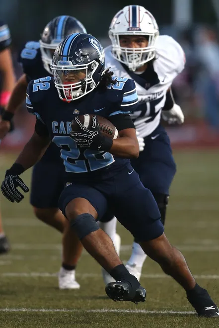 Carroll's Sebastian Robles looks for running room during a district football game against Veterans Memorial at Buccaneer Stadium on Friday, Oct. 9, 2026.