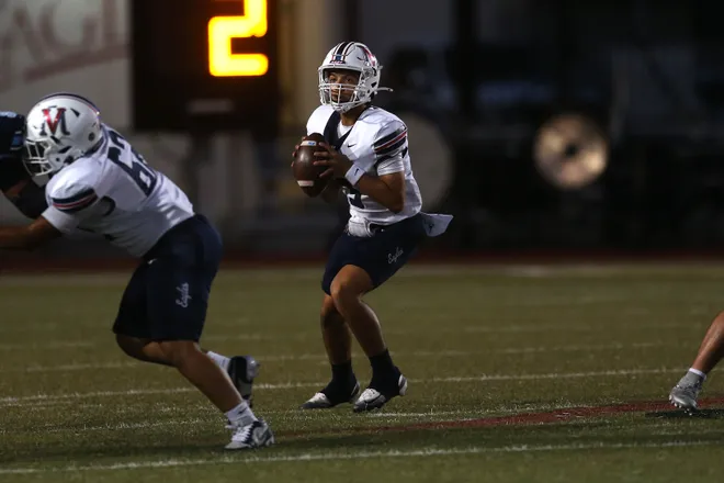 Veterans Memorial's Aaron Hinojosa drops back to pass during a district football game against Carroll at Buccaneer Stadium on Friday, Oct. 9, 2026.