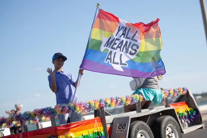 A parade participant greets people at the Pride Parade and Block Party hosted by Pride Corpus Christi at Water's Edge Park in Corpus Christi, Texas, on Oct. 10, 2026.