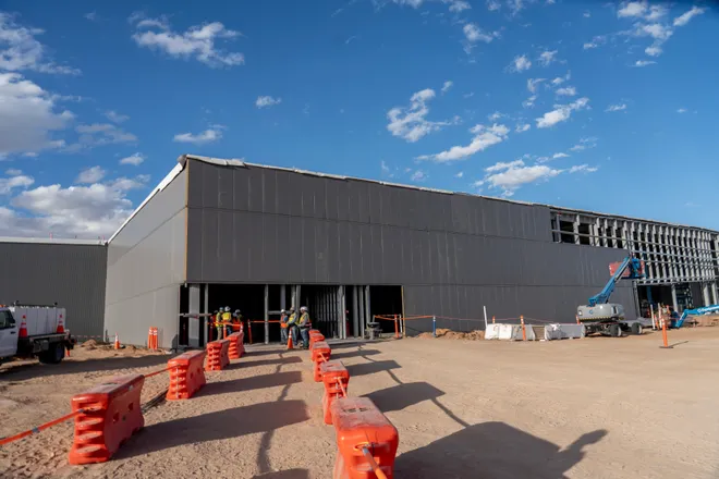 A data center building is seen in the background as members of the media tour Project Jupiter in Santa Teresa, N.M., on Tuesday, Oct. 13, 2026.