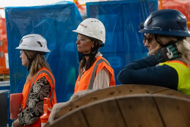 Members of the public relations team listen as reporters ask questions during a tour of Project Jupiter in Santa Teresa, N.M., on Tuesday, Oct. 13, 2026.