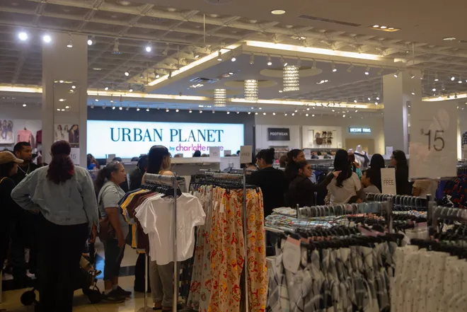 People wait in line to secure a free goodie bag from Urban Planet at La Palmera in Corpus Christi, Texas, on Oct. 16, 2026. The bags included sunglasses and a reusable water bottle, and some had gift cards with cash amounts from $10 to $250.