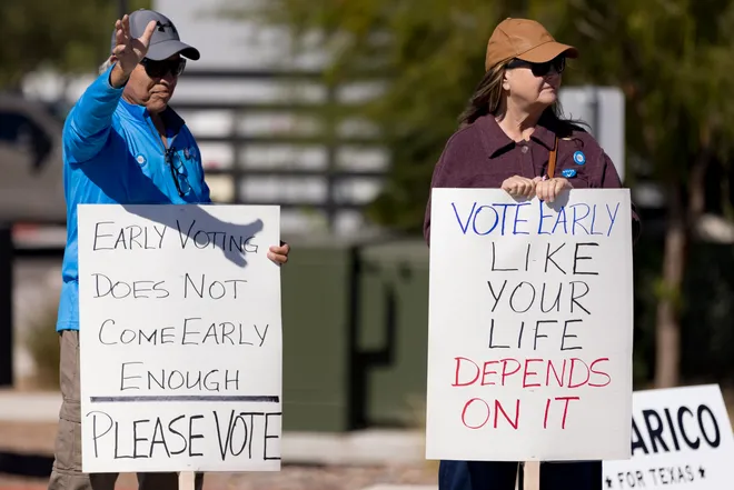 Participants hold signs encouraging early voting along Eastlake Boulevard during a “No Kings” sidewalk protest organized by Indivisible the 915 in El Paso, Texas, on Saturday, Oct. 17, 2026.
