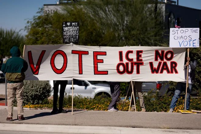 Participants hold a banner reading “Vote,” “ICE out” and “No war” along Eastlake Boulevard during a “No Kings” sidewalk protest organized by Indivisible the 915 in El Paso, Texas, on Saturday, Oct. 17, 2026.
