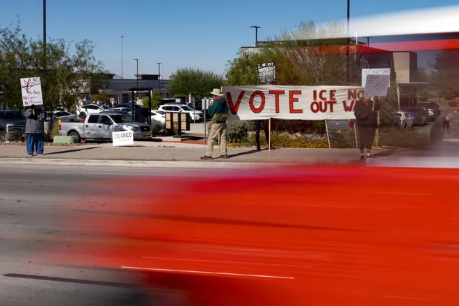 A vehicle passes demonstrators along Eastlake Boulevard during a “No Kings” sidewalk protest organized by Indivisible the 915 in El Paso, Texas, on Saturday, Oct. 17, 2026.
