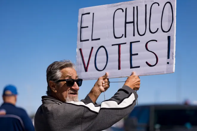 A participant holds an “El Chuco Votes!” sign along Eastlake Boulevard during a “No Kings” sidewalk protest organized by Indivisible the 915 in El Paso, Texas, on Saturday, Oct. 17, 2026.