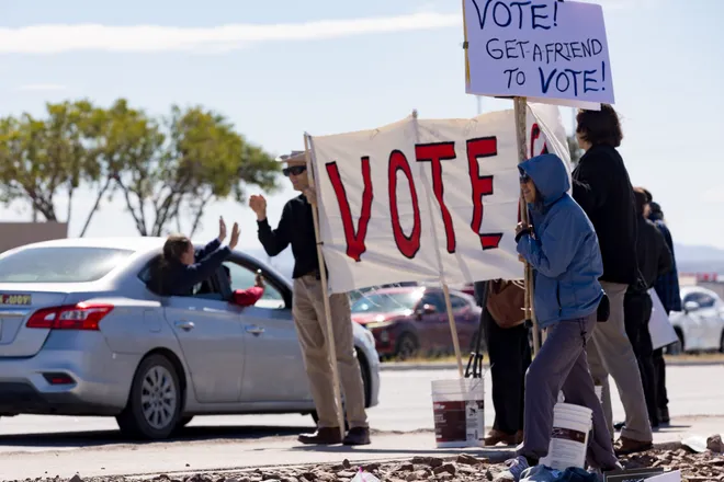 A passenger waves toward demonstrators along Eastlake Boulevard during a “No Kings” sidewalk protest organized by Indivisible the 915 in El Paso, Texas, on Saturday, Oct. 17, 2026.